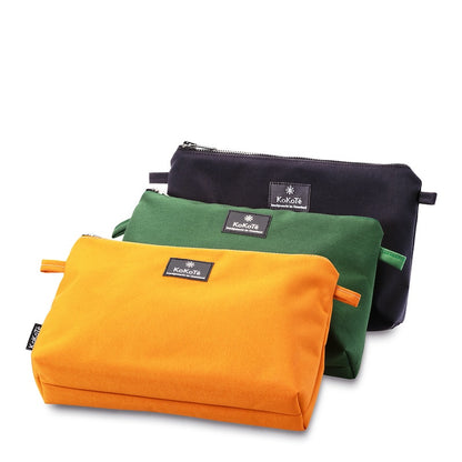 Necessaire «Nessi» L Safrangelb von KoKoTé, der Urner Taschenmanufaktur. Swiss made Taschen und Accessoires.